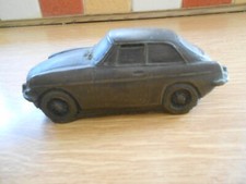 MGB GT carved into Brown Coal